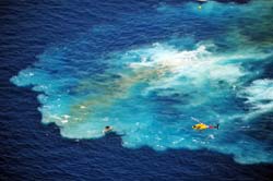Helicopter and small boat remain after the sinking of the Vandenberg 7 miles from Key West