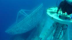 scuba diver and radar dish on Vandenberg wreck
