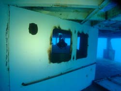Scuba diver through a window on the Vandenberg wreck in Key West